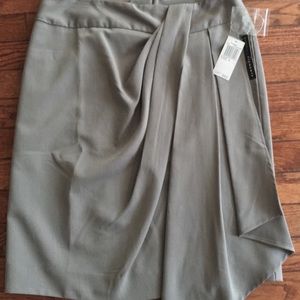 Classy gray skirt with pleat  detail on side.